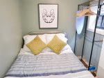 Full sized bed in the bedroom is perfect for business travelers or traveling couples 